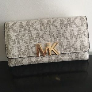 Michael Kors gold and cream wallet